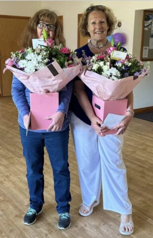 Post Office staff with retirement/leaving flowers